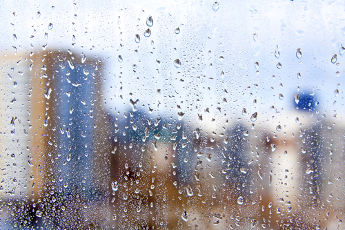 HSG Waterproofing: High-rises seen through rainy window